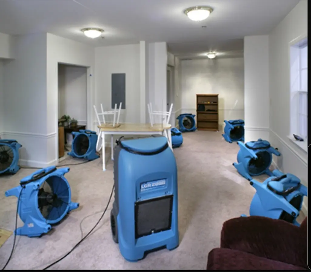 Air movers and dehumidifier setup for Water Damage Restoration in St. Louis